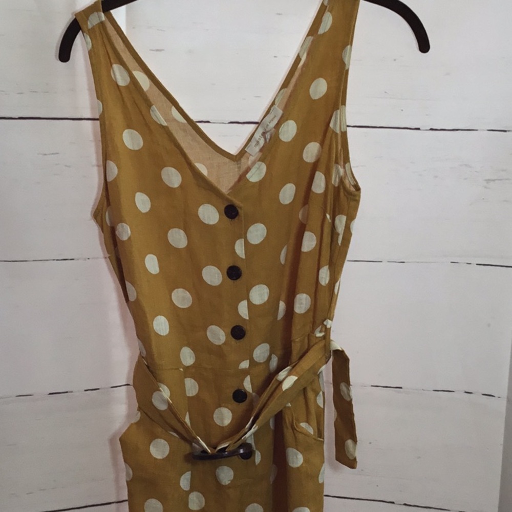 Yellow with white Polka Dot romper Size medium In like new condition Easy outfit